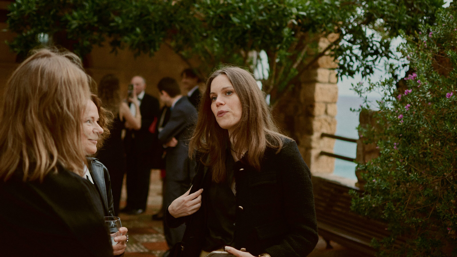 Guest raising a glass in cheer