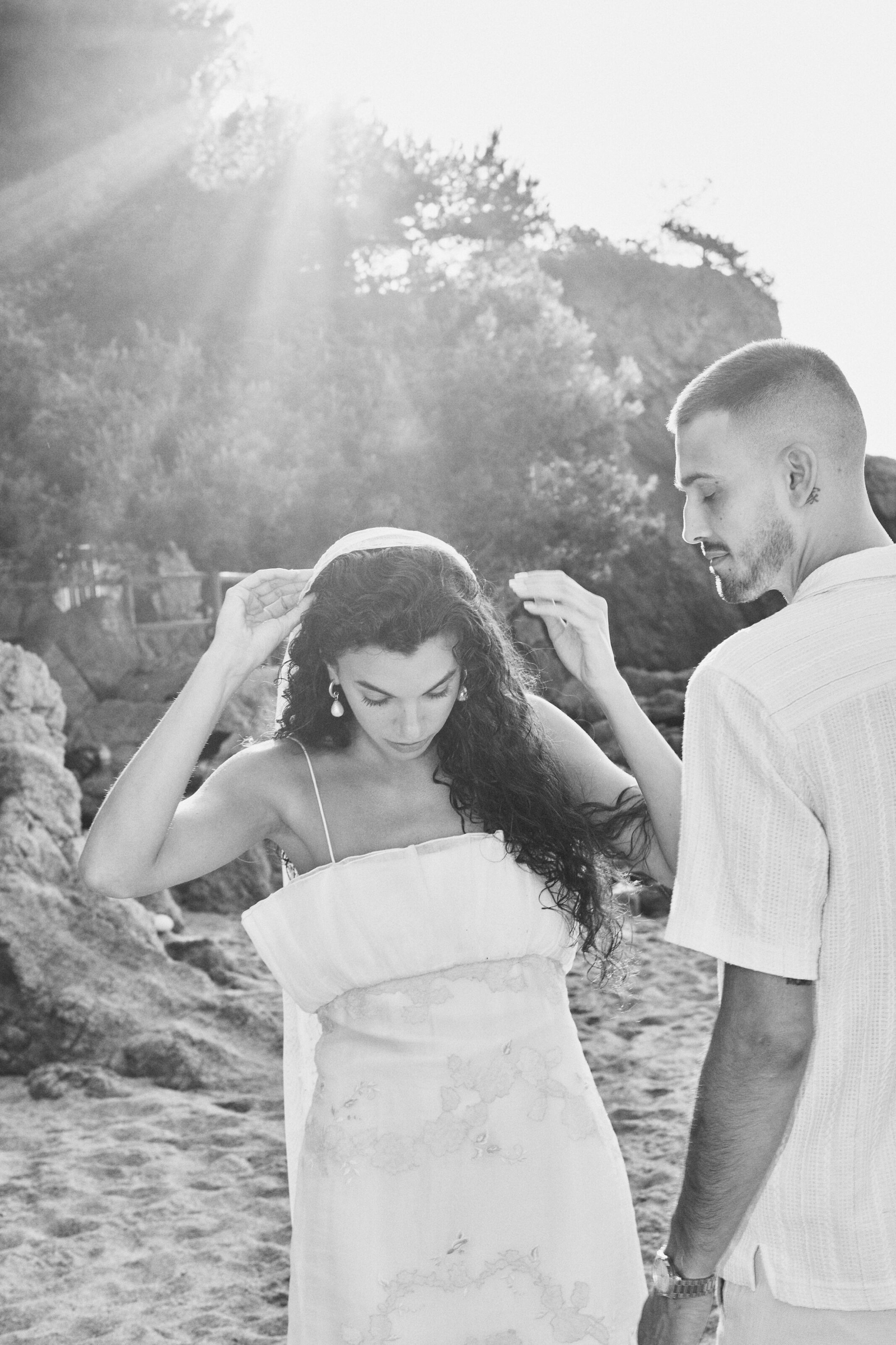 Groom holding bride close