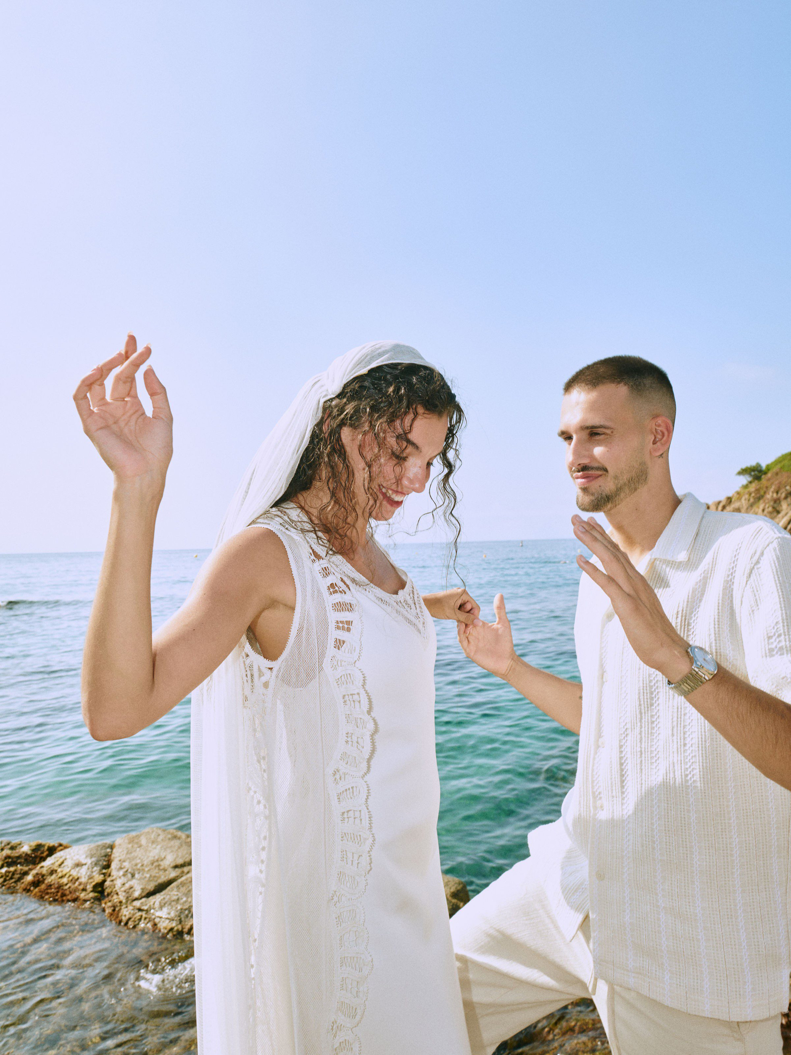 Groom holding bride close